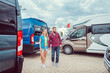 © Kzenon - Couple facing abundance of choice in camper vans to buy