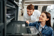 © fotofabrika - Young couple choosing new electric oven in hypermarket