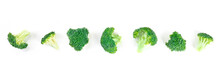 Broccoli Florets Panorama. Many Small Slices Of Broccoli, Shot From The Top On A White Background. A Flat Lay Composition For A Vegan Panoramic Banner