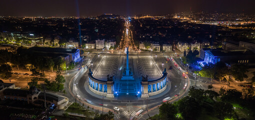 Wall Mural - Budapest, Hungary - Aerial panoramic view of Heroes' Square by night lit with unique blue lights. Andrassy street at background