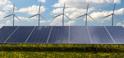 Wall Mural - photovoltaic panels and windmills in a meadow of blooming dandelions