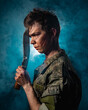 © ISliM - Portrait of a soldier with scars and combat coloring, holding a machete in the urns on a black background witch blue smoke