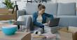 © StockPhotoPro - Woman moving in her new home and connecting with her laptop