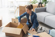 © StockPhotoPro - Young woman moving in her new apartment