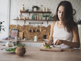 young woman preparing breakfast in the kitchen