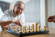 © Kawee - Asian old man enjoy playing chess together with friend in nursing home