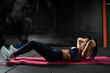 © nazarovsergey - Athletic young woman doing crunches during workout in gym