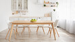 © Prostock-studio - Scandinavian home interior. White and wooden kitchen furniture, plate with apples on dinning table, panorama