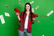 Photo of brunette hooray young lady fly money wear shirt jeans isolated on green color background