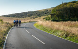 Fototapeta Londyn - Cycling the South Downs, East Sussex, England. A group of road cyclists training on the quiet roads of the South English countryside.