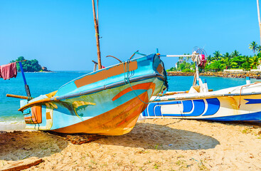 Wall Mural - Fishing boats on the beach of Midigama resort, Sri Lanka