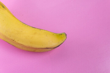 Wall Mural - Banana on the pink background