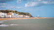 Hastings, East Sussex, England. The seafront to the popular seaside resort with its landmark castle visible on the hill.
