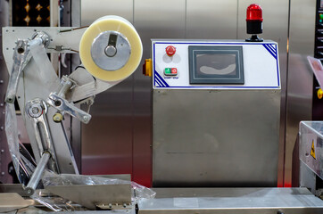 Wall Mural - Automatic packaging machine for producing packs  from a roll of heat-sealable packaging film