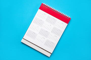 calendar page on blue background business planning appointment meeting concept