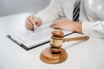 Wall Mural - Lawyer preparing to sign a contract reading documents at meeting