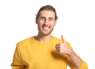 Poster - Handsome young man showing thumb-up on white background