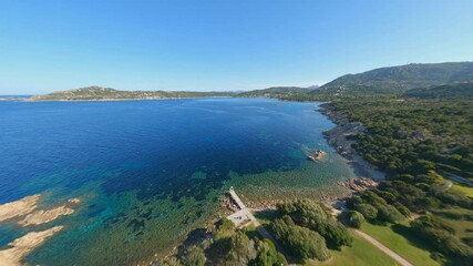 Sticker - View from above, stunning aerial video shoot by an FPV drone flying at high speed over a turquoise water. Mediterranean sea, Costa Smeralda, Sardinia, Italy.