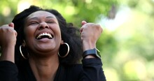 Ecstatic Woman Celebrating Success And Achievement, African Black Ethnicity