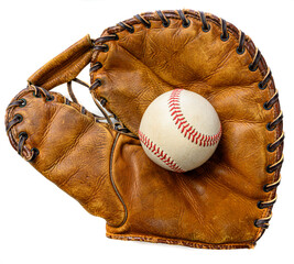 A white leather baseball in a brown vintage, antique glove