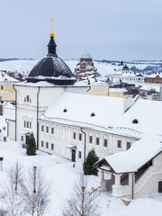 Wall Mural - View from tower to historic buildings of Sviyazhsk, near Kazan, Russia. Foreground: fraternal building of Uspensky Monastery, behind: John Baptist Monastery. Background: banks of frozen Volga River