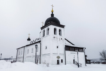 Wall Mural - Temple of Sergius of Radonezh in village of Sviyazhsk, near Kazan, Russia. This is refectory temple, built in 1604. Inscription above door translates as 'Monastic refectory' (in Russian)