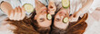 © Daria Lukoiko - Two girls make homemade face and hair beauty masks. Cucumbers for the freshness of the skin around the eyes. Women take care of youthful skin. Girlfriends laugh at home lying on the floor on pillows.