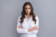© Olena - Serious confident business woman hold arms crossed grey, confidence
