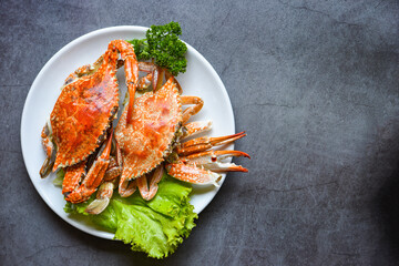 Wall Mural - Steamed or boiled Blue Swimming Crab ocean gourmet with salad vegetables lettuce, Fresh seafood crab cooking food in the restaurant, top view