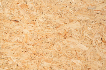 Wall Mural - OSB sheet is made of brown wood chips pressed together into a wooden floor.