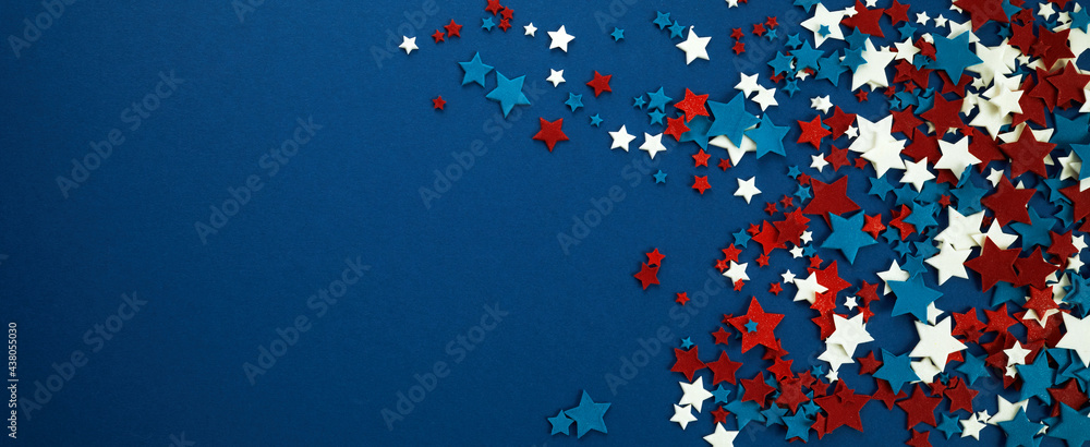4th of July American Independence Day stars decorations on blue background. Flat lay, top view. - obrazy, fototapety, plakaty 