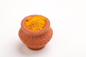 Wall Mural - Turmeric powder in clay bowl.