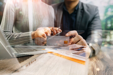 Business women reading document on office with tablet and graph financial diagram.Teamwork workplace strategy Concept.