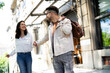 © JustLife - Happy young couple outdoors. Loving couple walking in the city.