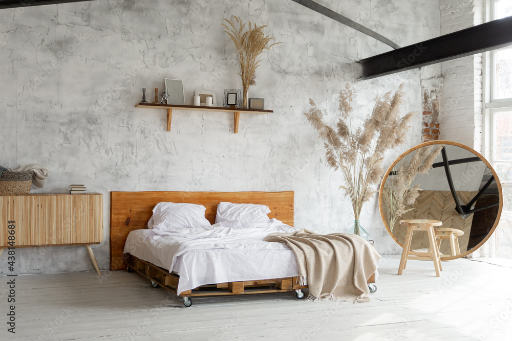 Side view of pacious airy white industrial loft bedroom with bed ...