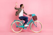 Full length profile side photo of young guy happy positive smile ride bicycle wave hand hello isolated over pastel color background
