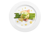 Fototapeta  - Delicious breakfast asparagus with poached egg, bacon, hollandaise sauce in a white plate. Isolated on white background. View from above