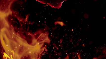 Wall Mural - Flying pieces of raw beef steaks with fire flames falling on table. Filmed on high speed cinema camera, 1000 fps.