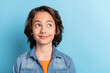 © deagreez - Photo of young preteen boy happy positive smile dream think look empty space isolated over blue color background