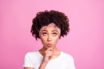 Wall Mural - Photo of minded clever woman finger chin look up empty space wear white t-shirt isolated pink background