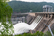 Water Drain Wave, Rapid Water Flows At The Krasnoyarsk Dam Hydroelectric Power Station In Russia. Floods And Surf Waves