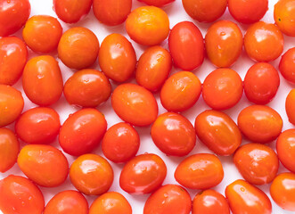 Wall Mural - High angle view of full frame image of bright red tomatoes. Suitable for food background or artwork.