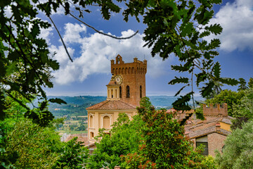 Wall Mural - View on the bell tower of the Duomo and the church of S.S. Crucifix in San Miniato Tuscany Italy