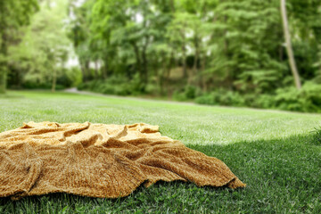 Sticker - Brown blanket on grass and free space for your decoration. 