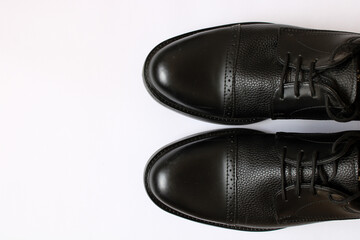 black dress shoes on white background