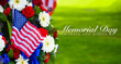 A beautiful wreath of flowers and a flag on Memorial Day