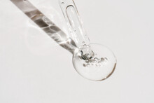 A Drop Of Cosmetic Oil Falls From The Pipette
