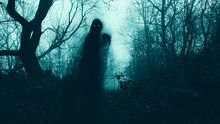 A Horror Concept Of A Blurred Scary Hooded Figure With Glowing Eyes On A Path Through A Moody Misty Winter Woodland