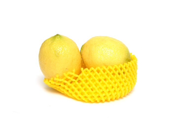 2 ripe yellow lemons on a white background