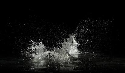 Wall Mural - water splash on black background